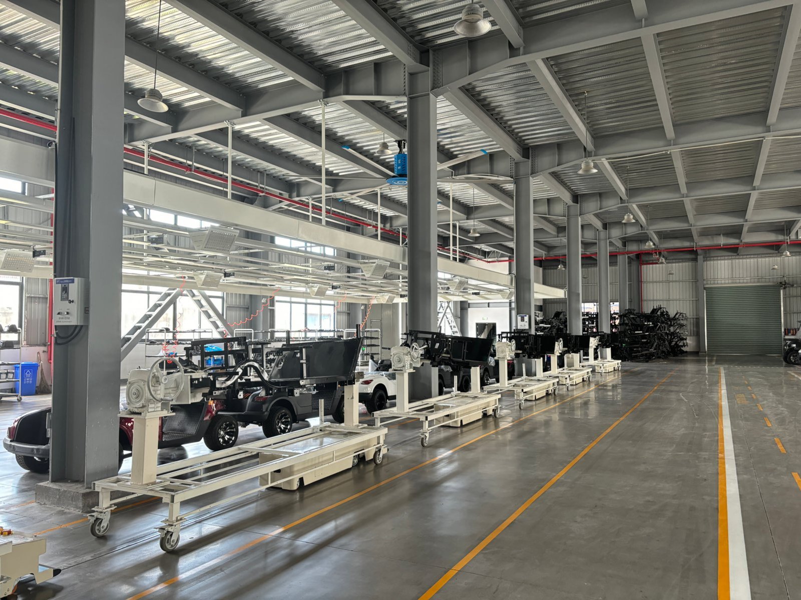 Golf cart manufacturing facility with assembly line